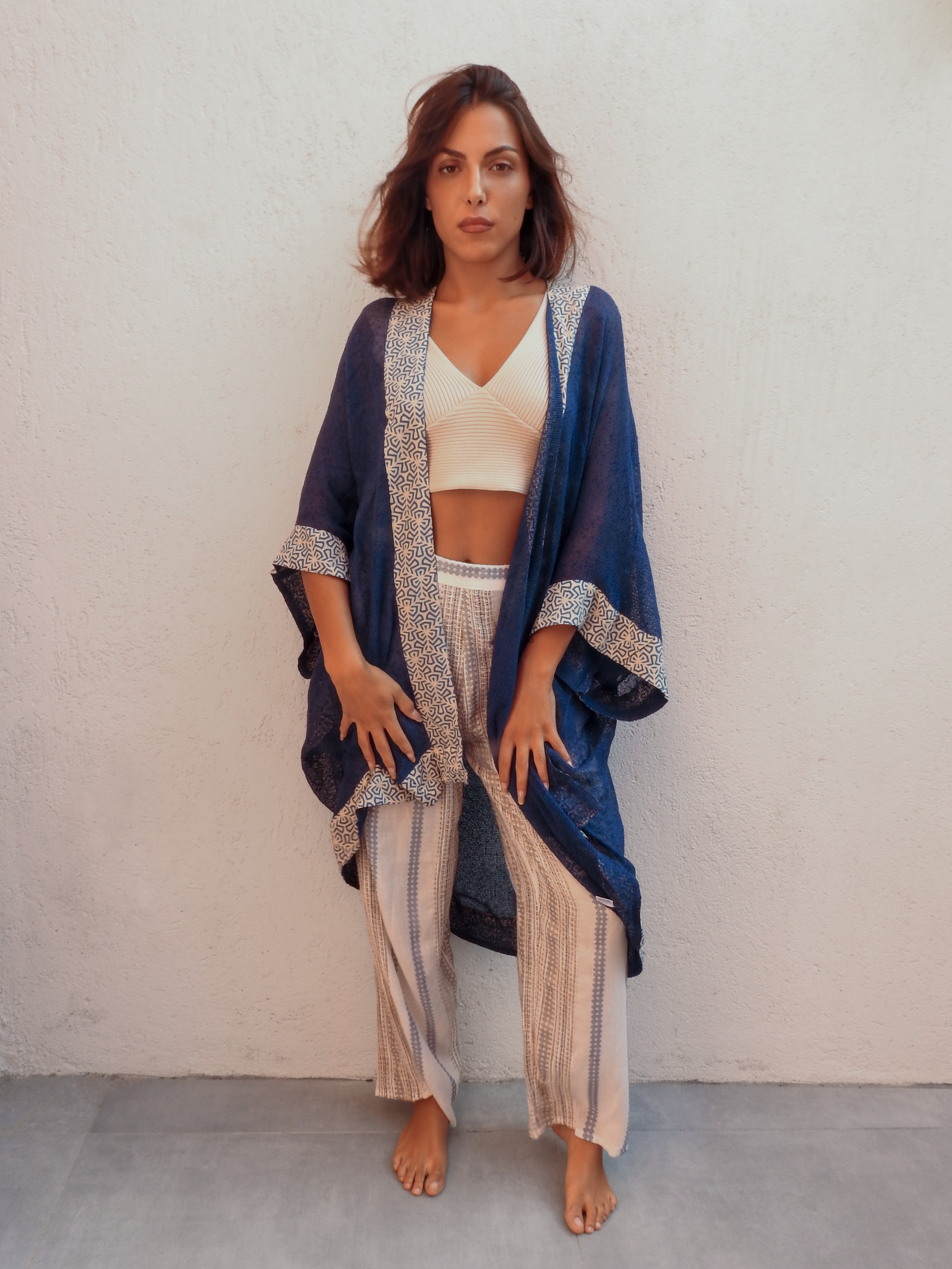 Sleeveless wrap-style jacket