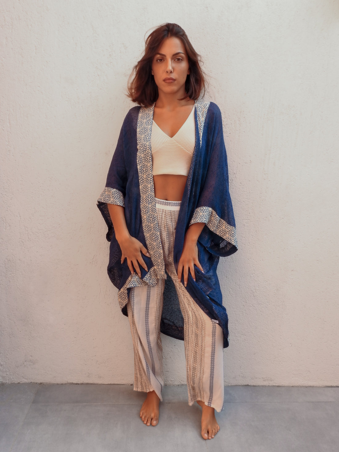 Sleeveless wrap-style jacket