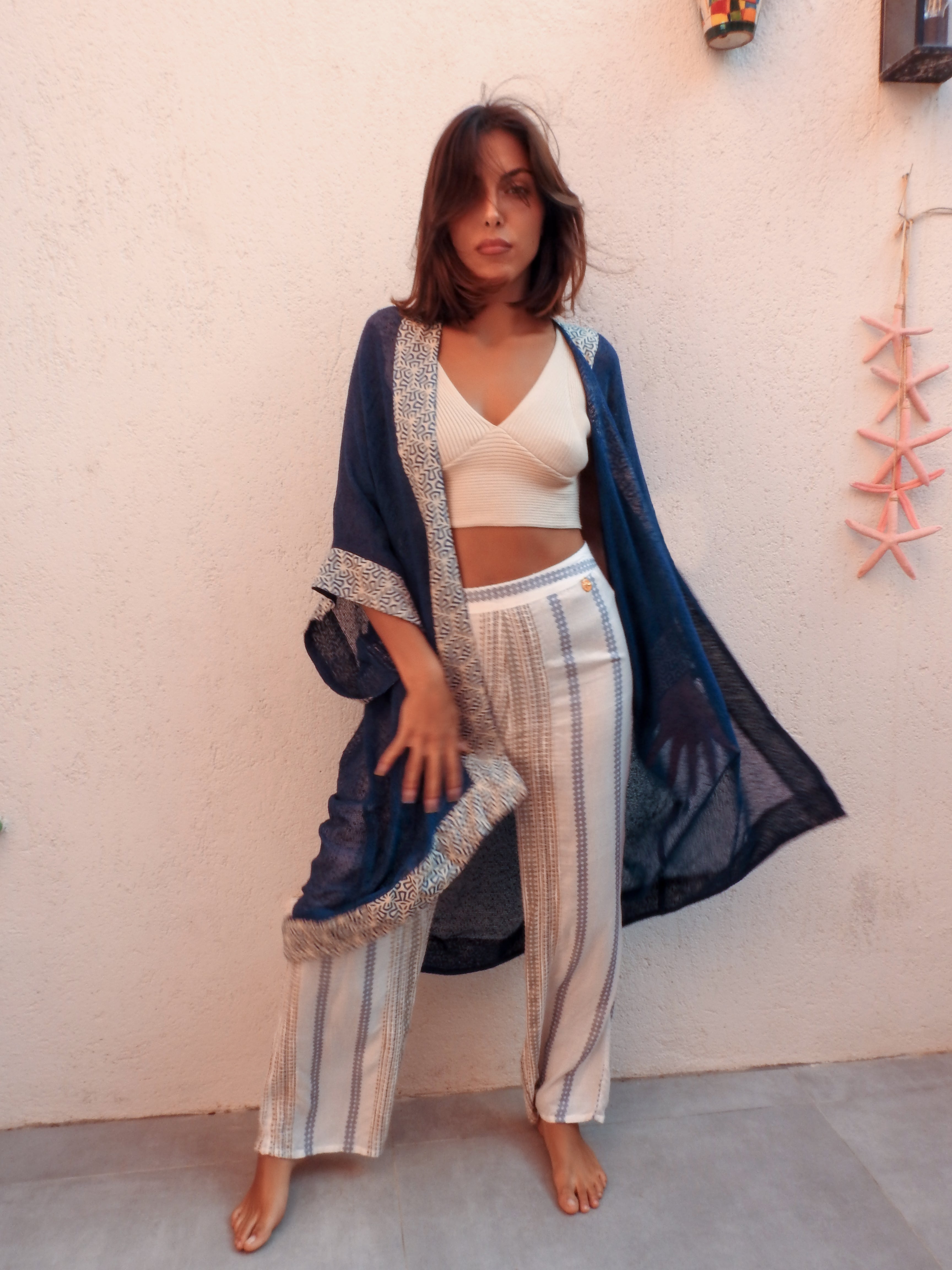 Sleeveless wrap-style jacket