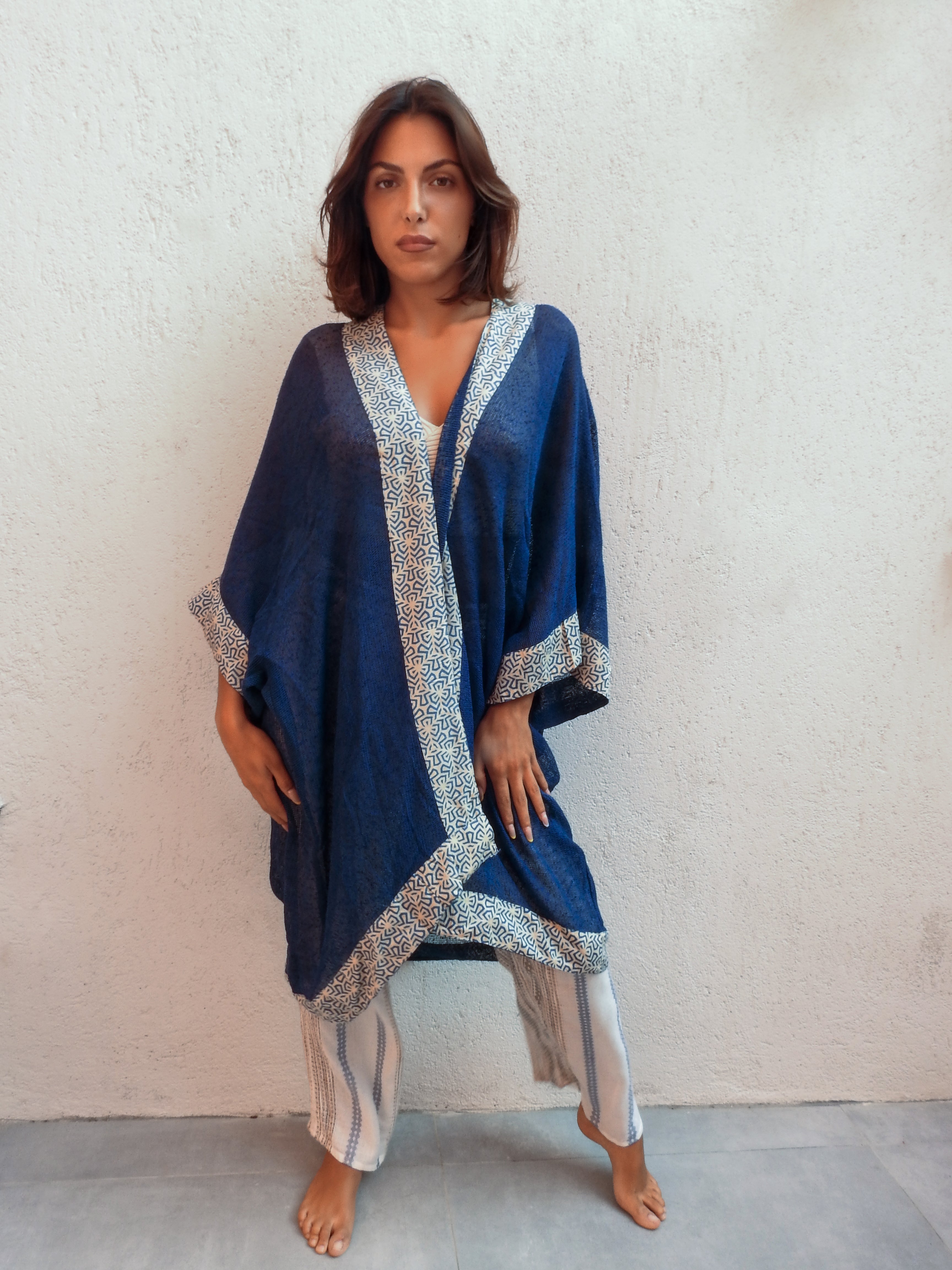 Sleeveless wrap-style jacket