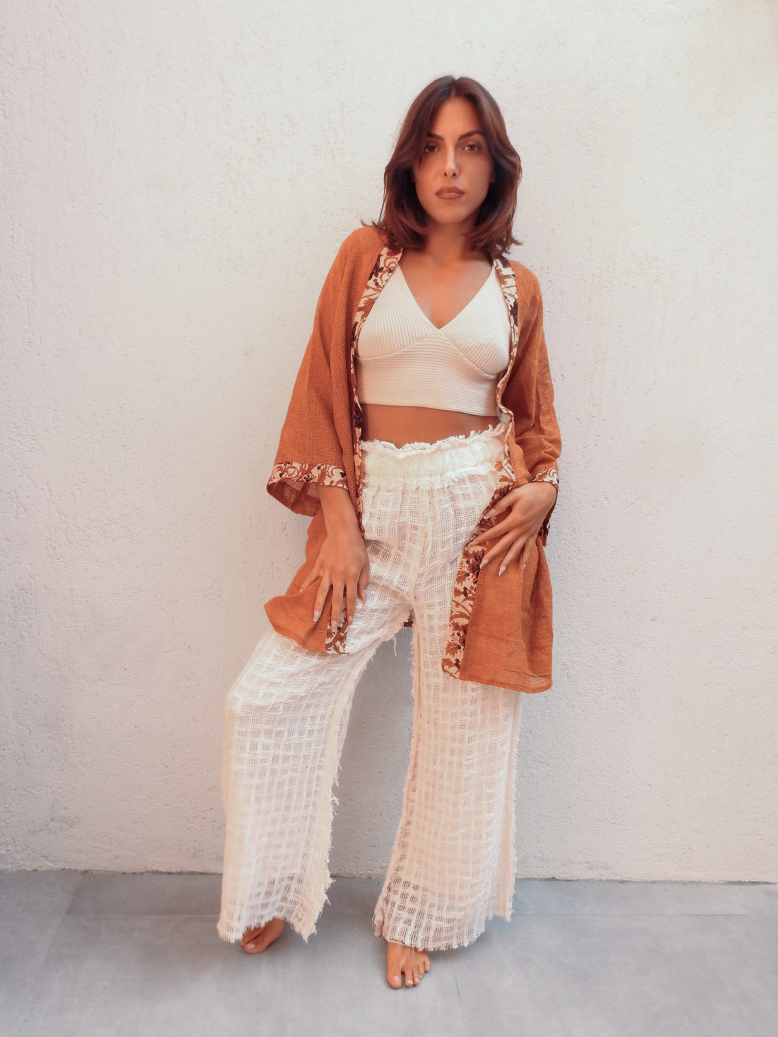 Sleeveless wrap-style jacket