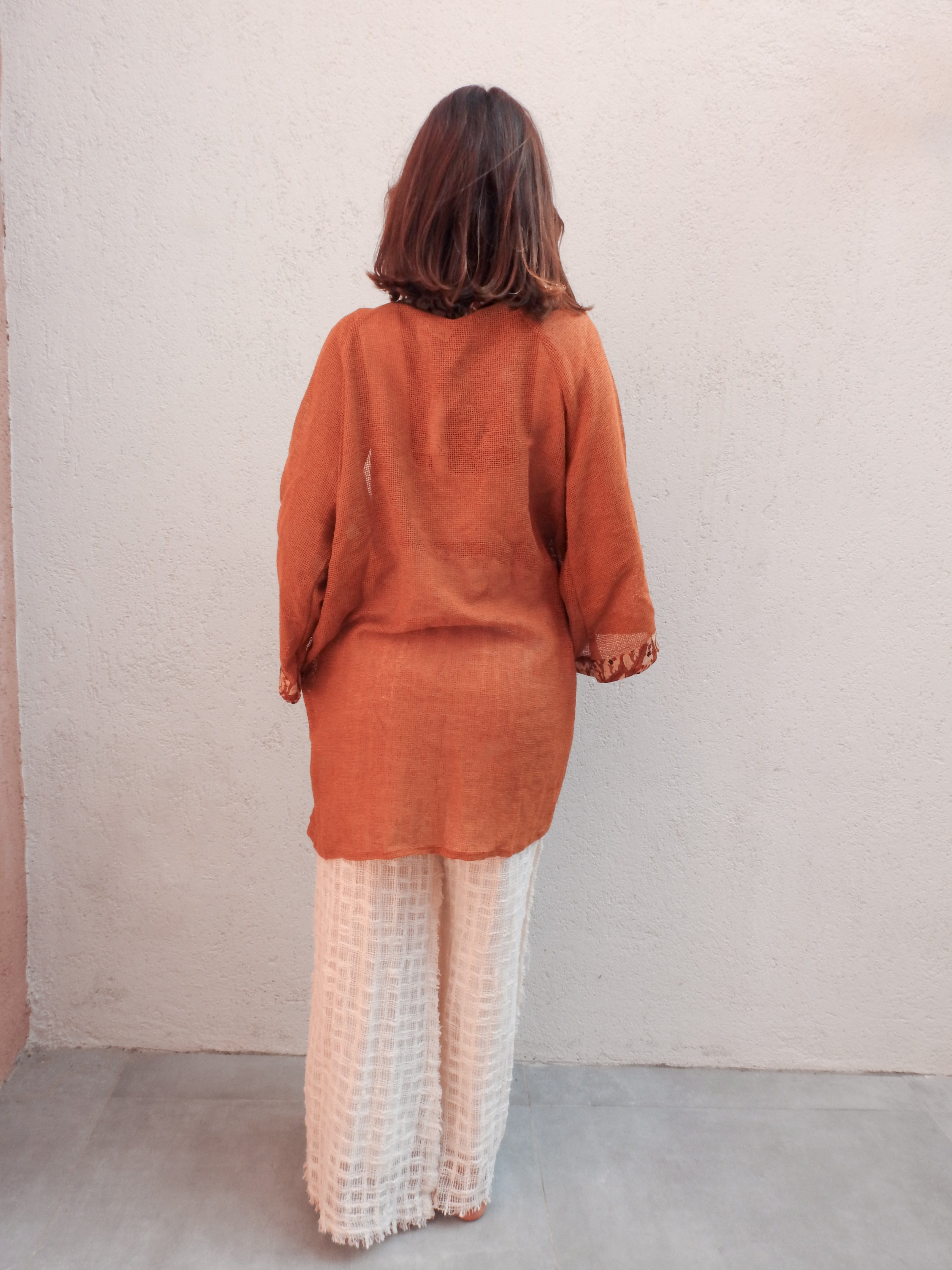 Sleeveless wrap-style jacket