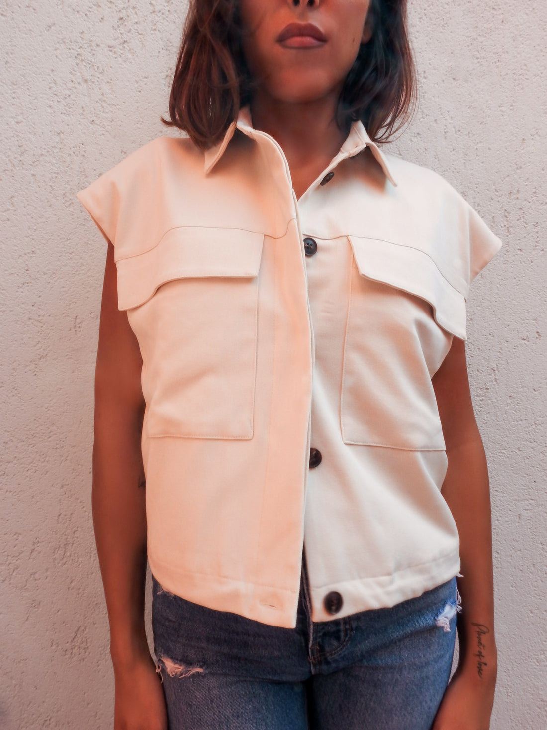 Sleeveless cream utility jacket vest