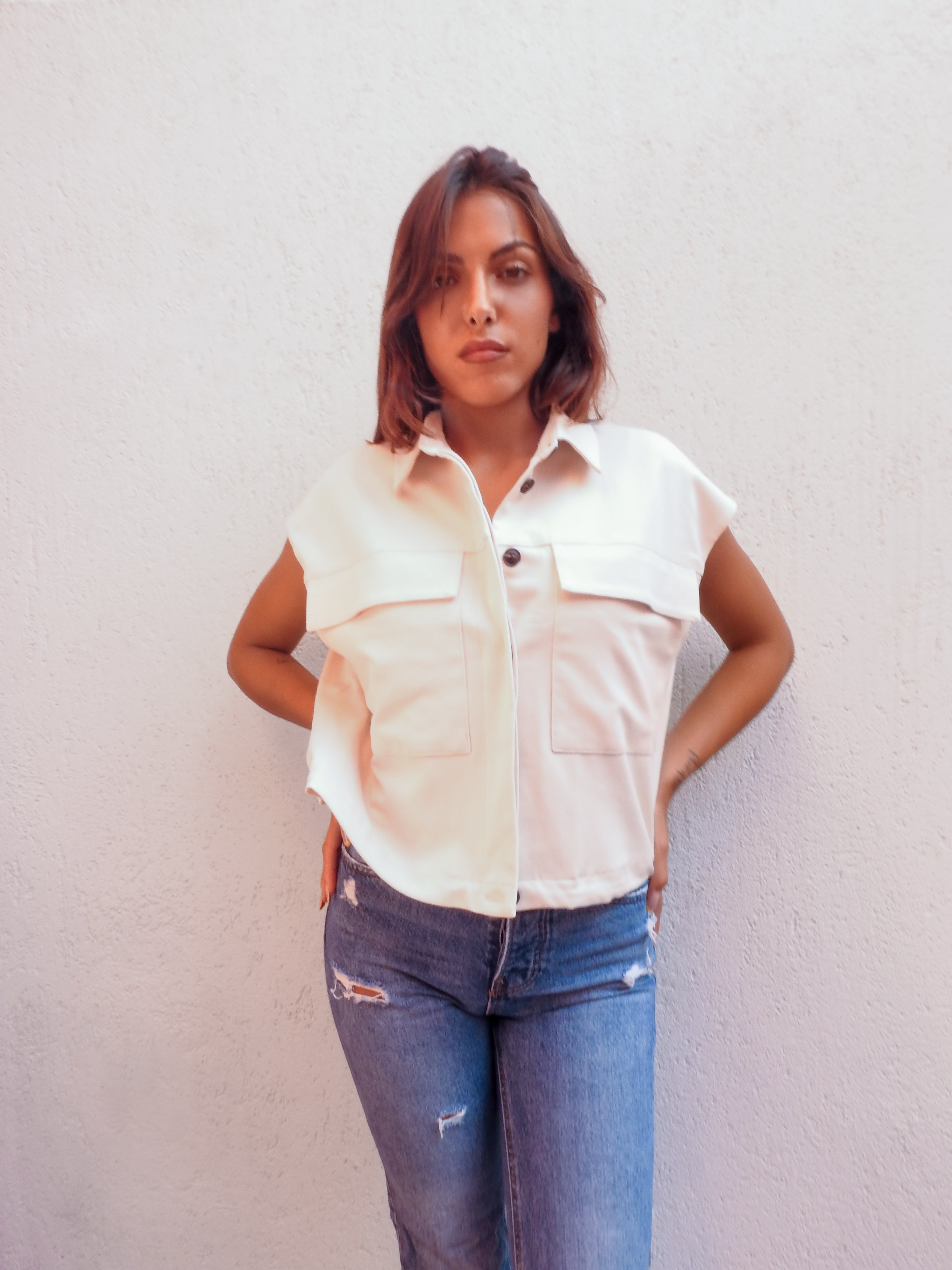 Sleeveless cream utility jacket vest